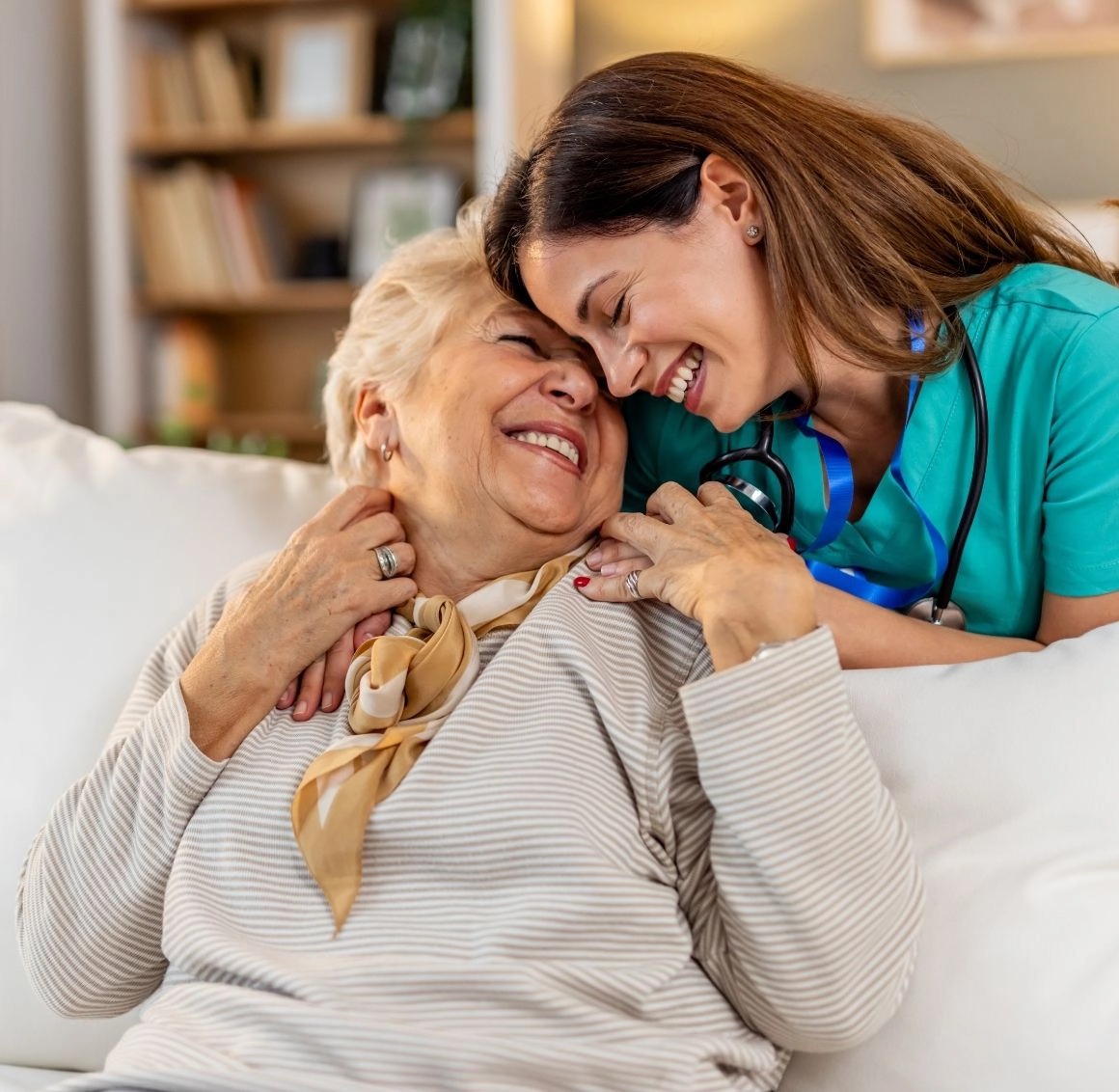 Caregiver sharing a warm moment with a senior woman