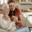 Caregiver supporting an elderly woman in the transition to senior home care