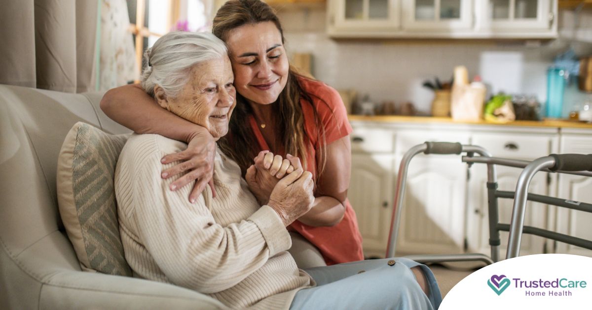 Caregiver supporting an elderly woman in the transition to senior home care